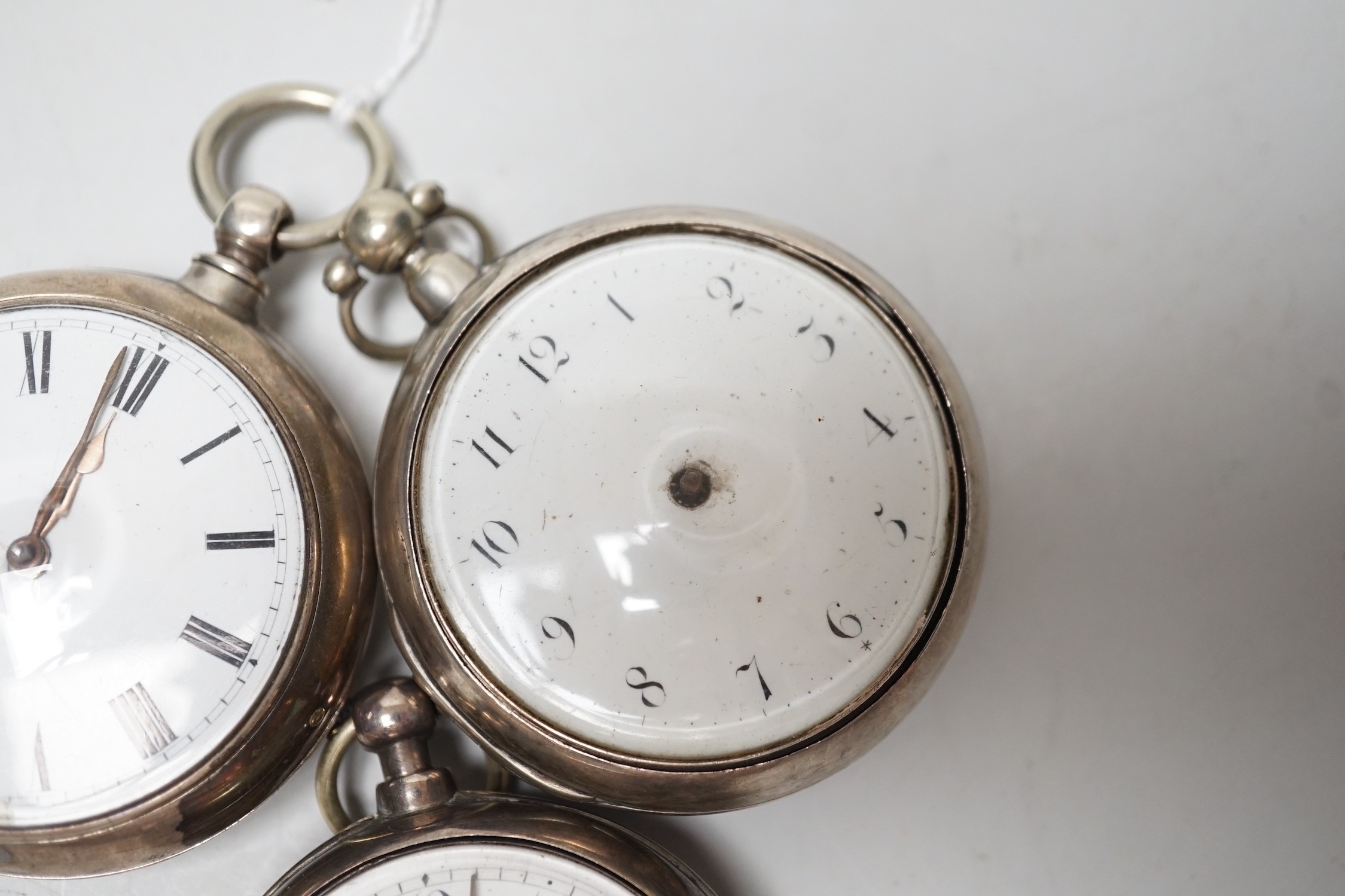 Three 19th century silver pair cased keywind verge pocket watches, by Graham, London, one signed WG, the other unsigned.